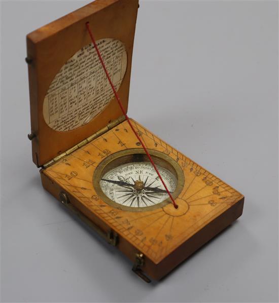 A boxwood sundial and compass